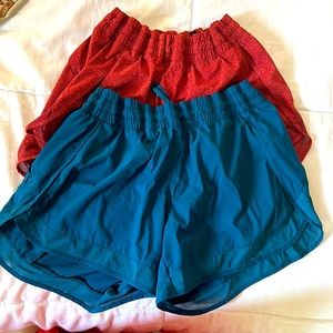 2 pairs medium athleta running shorts